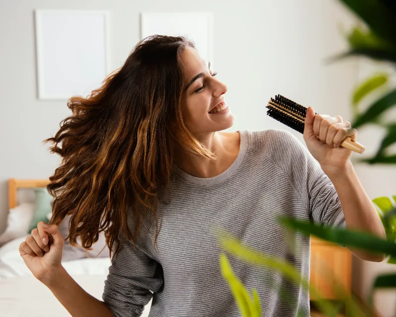 happy girl comb in hand 